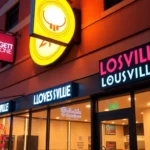 Custom sign company in Louisville showcasing illuminated business signs on a modern building at dusk, emphasizing quality craftsmanship and branding impact